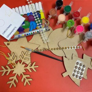 Christmas ornaments with paints, brush, sketch pens, decorative stickers